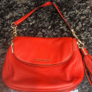 Michael Kors bag.   Used once.  Red/orange color.   Leather.   Beautiful
